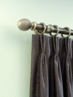 Curtain Header - turned metal pole with purple cloth